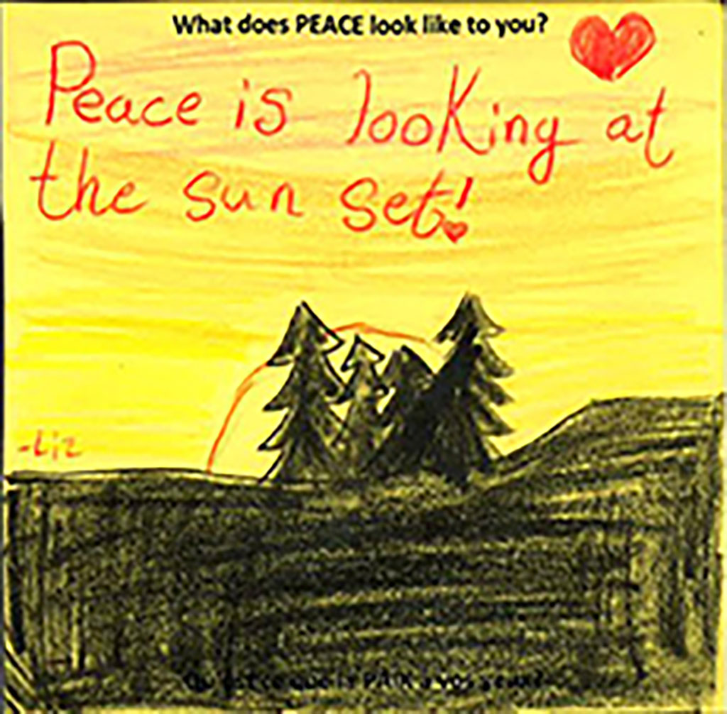 A yellow piece of paper and trees drawn on it.