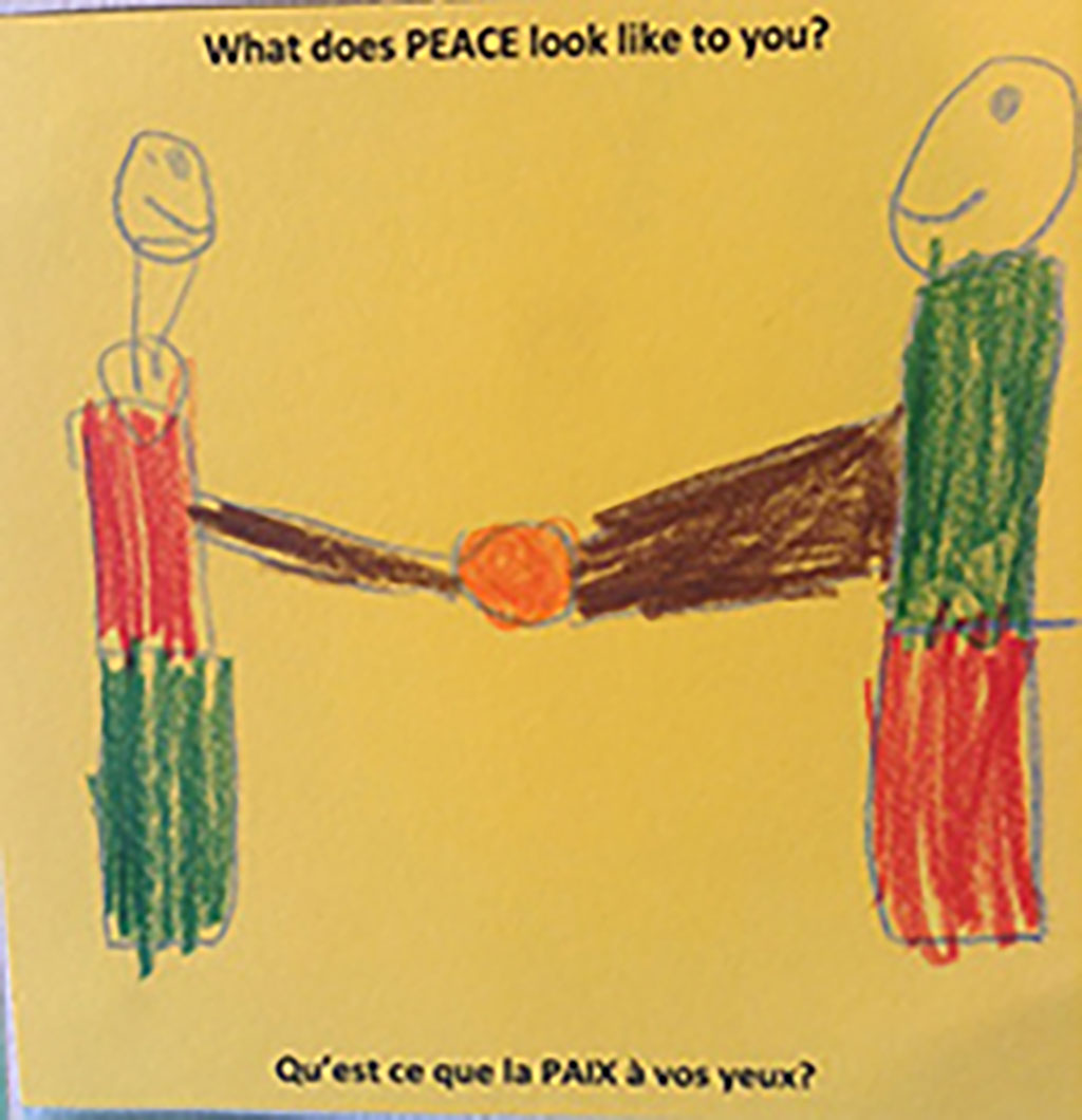 A yellow piece of paper with some characters shaking their hands, maybe drawn by a child.