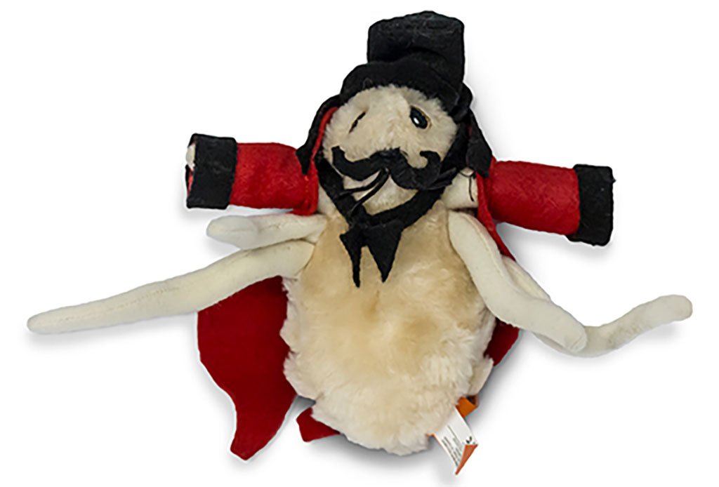 A cute tiny stuffed bug with red and black clothing and a black top hat.