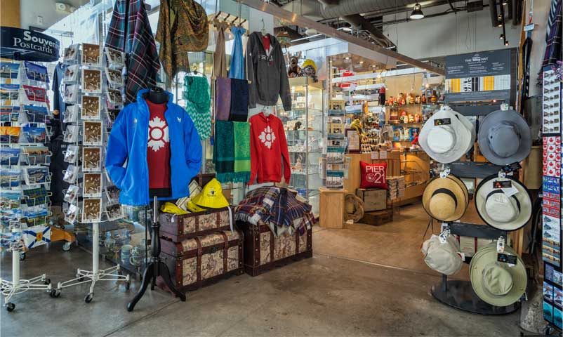 Shelves and glass display cases overflow with hats, clothing, postcards, jewellery and collectibles from around the world.