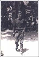 Young man walking toward camera.