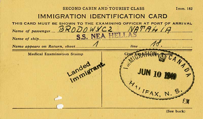 Immigration identification card on a yellow paper with two stamps, name of passenger Brodowycz Natalia and name of ship.