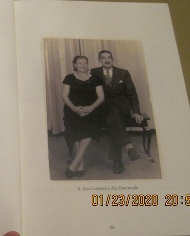 A digital photo of a black and white photograph of two people dressed formally and posing.