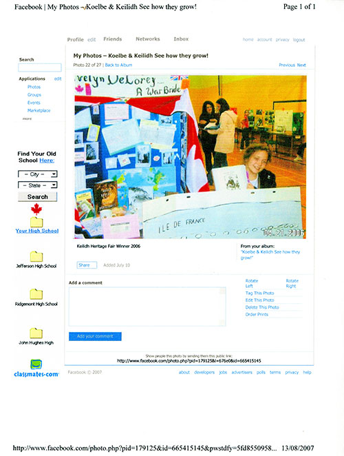 Facebook screen shot of a young girl in front of a bulletin board with lots of papers on it.