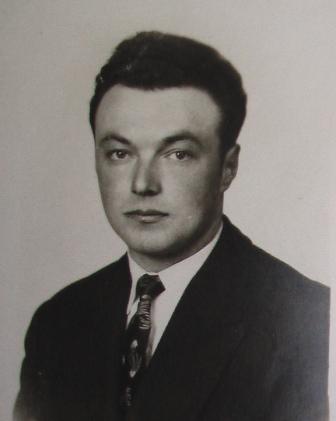 Portrait of Giovanni, young man in suit and tie.