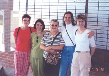 Karen and her family in front of plaques at Pier 21.