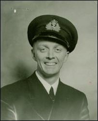 Young John in military uniform and cap.