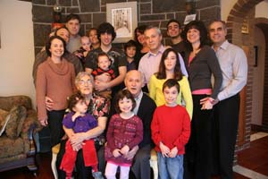 Recent colour photograph of three generations of the Petti family.