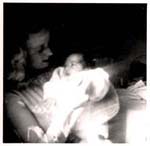 Young Ilse holding small baby girl.