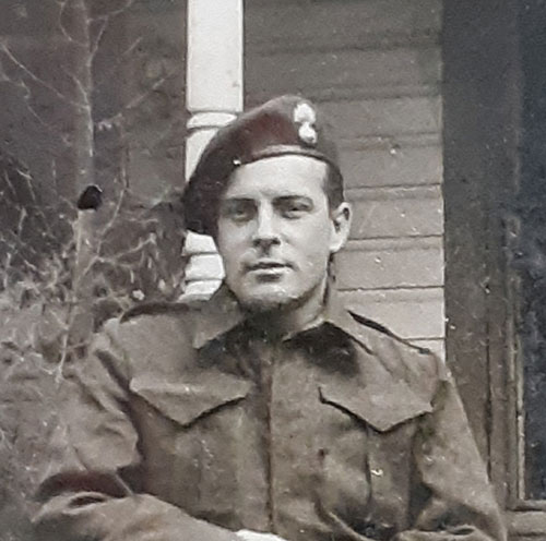 Archival image of a young man in military uniform.