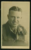 Close-up of Gerald, young man, wearing military clothing.