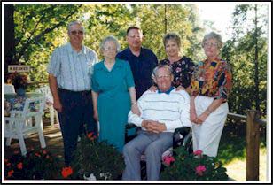 Beuker family members outside on the patio on a sunny day.