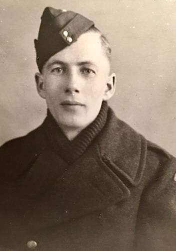 Black and white portrait of a white man in a Royal Canadian Artillery hat and coat.