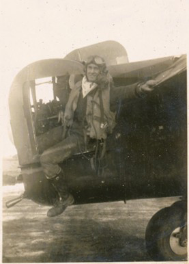 Sepia photo of tail gunner Les Gallant exiting the aircraft.
